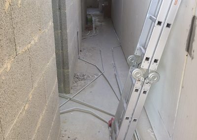 The hall from main bedroom showing all electrical conduits heading towards the main living area