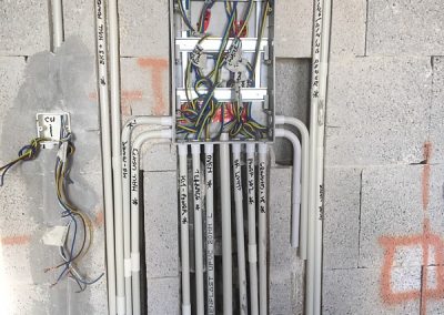 wall chased and consumer unit now full of cables