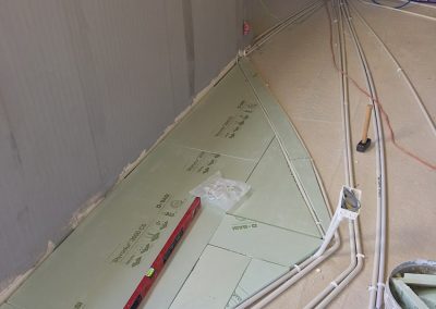Floor insulation cut around the conduit