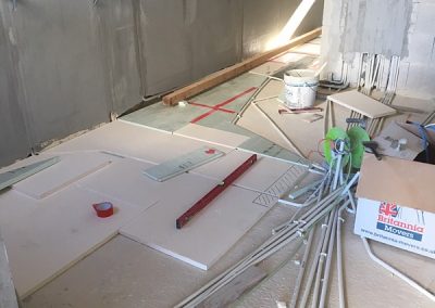Backing away from the hallway, floor insulation in the kitchen