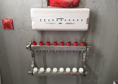 Manifold & heatmiser (loosely) attached to the wall