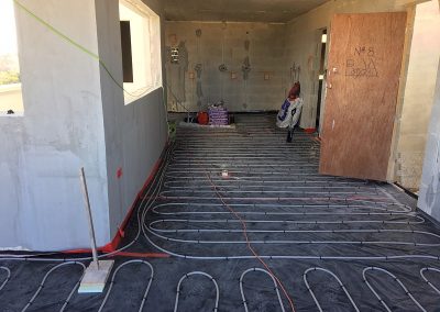 Living, dining and kitchen areas all UFH piped up