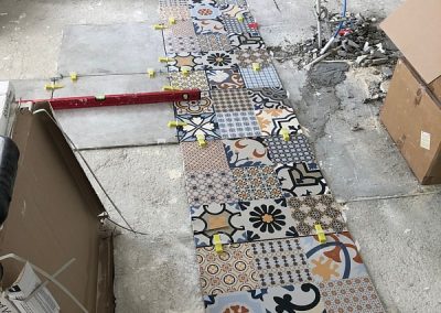 The very first tiles going down!