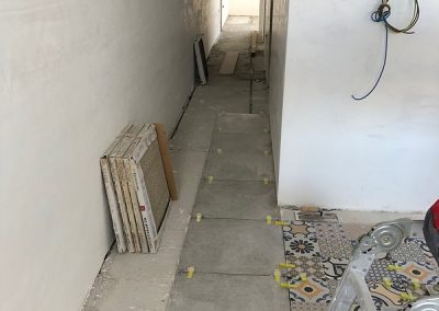 The start of tiles in the hallway
