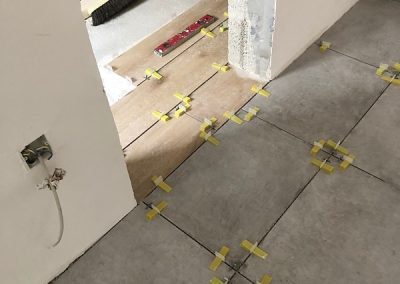 Guest bedroom ensuite tiles being started