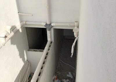 Waste pipes finally in at rear of property