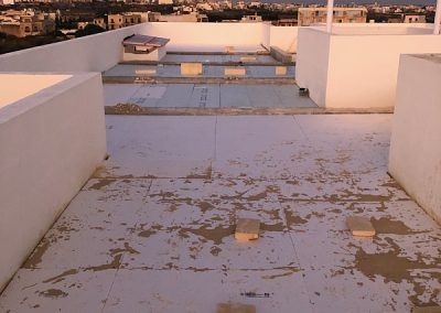 Insulation panels on the roof at sunrise with the moon in the distance