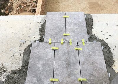 First few tiles laid on rear balcony