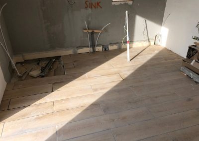Bedroom tiles complete and grouted less shower area