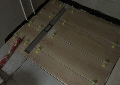 Tiles going down in 1 of the shower areas