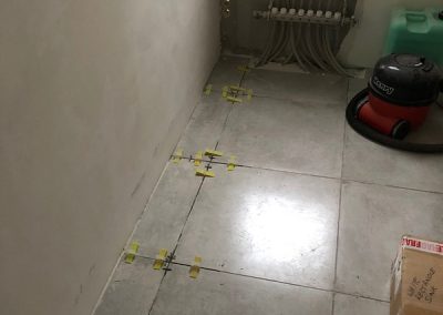 Guest room - final tiles laid after plastering completed on the wall