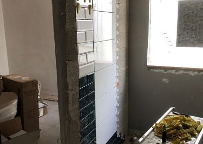 More tiles in the guest en-suite with area ready for towel radiator