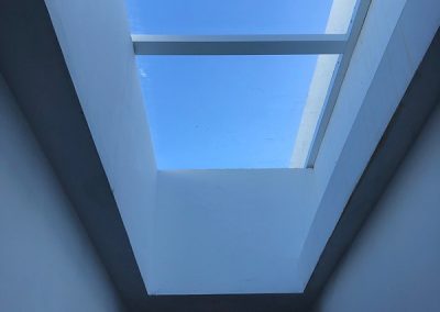 The fitted/finished skylight on a lovely blue sky day