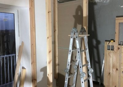 A wardrobe going up next to the main bedroom shower cubicle