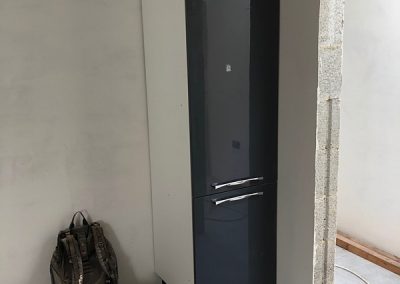 The unused kitchen cabinet installed in Bedroom 3