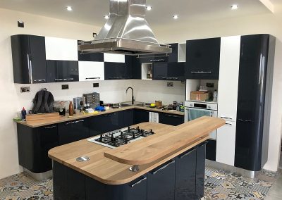 Kitchen complete with island oak worktop and raised bar